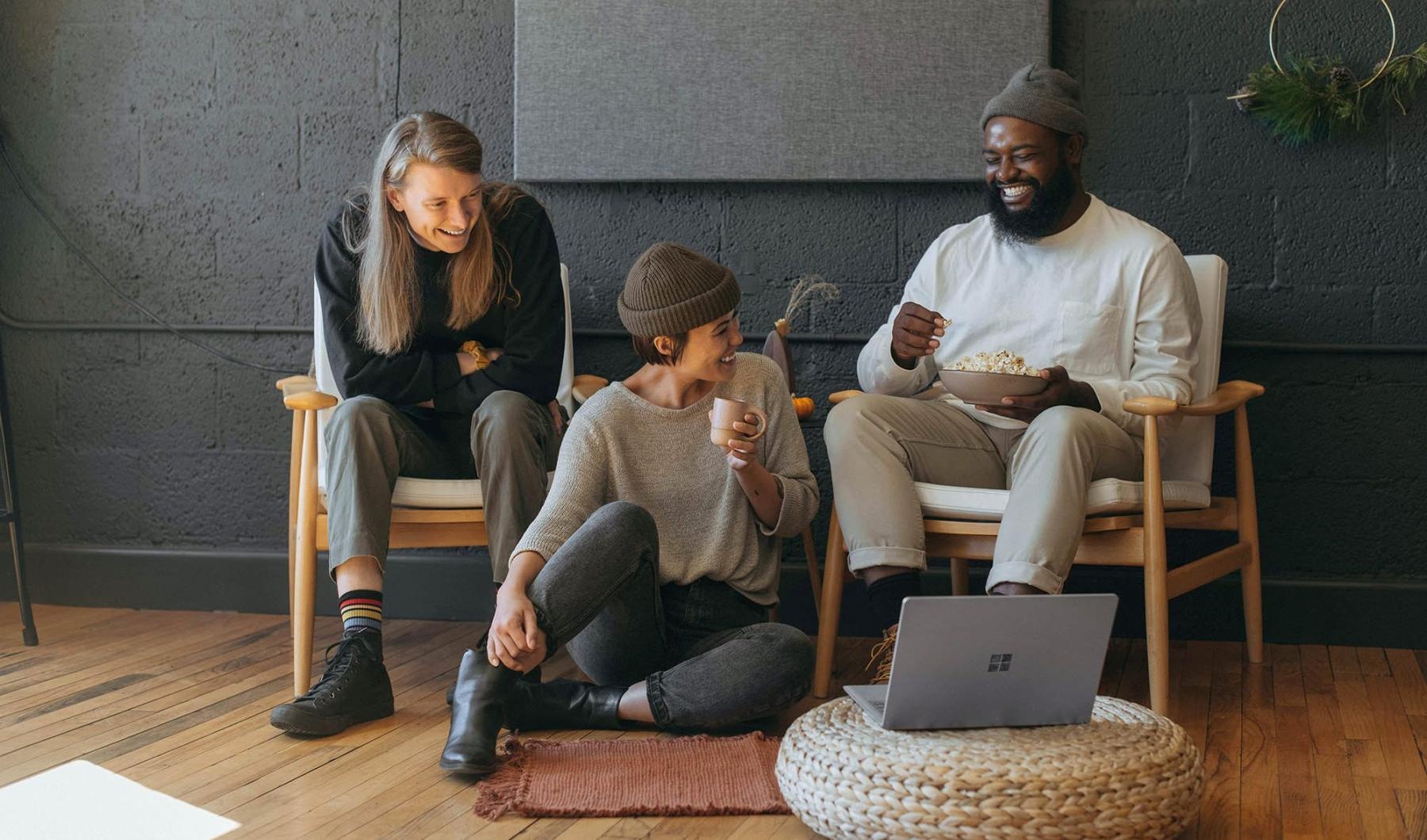 Refined spaces to match your style friends sit together around an open laptop